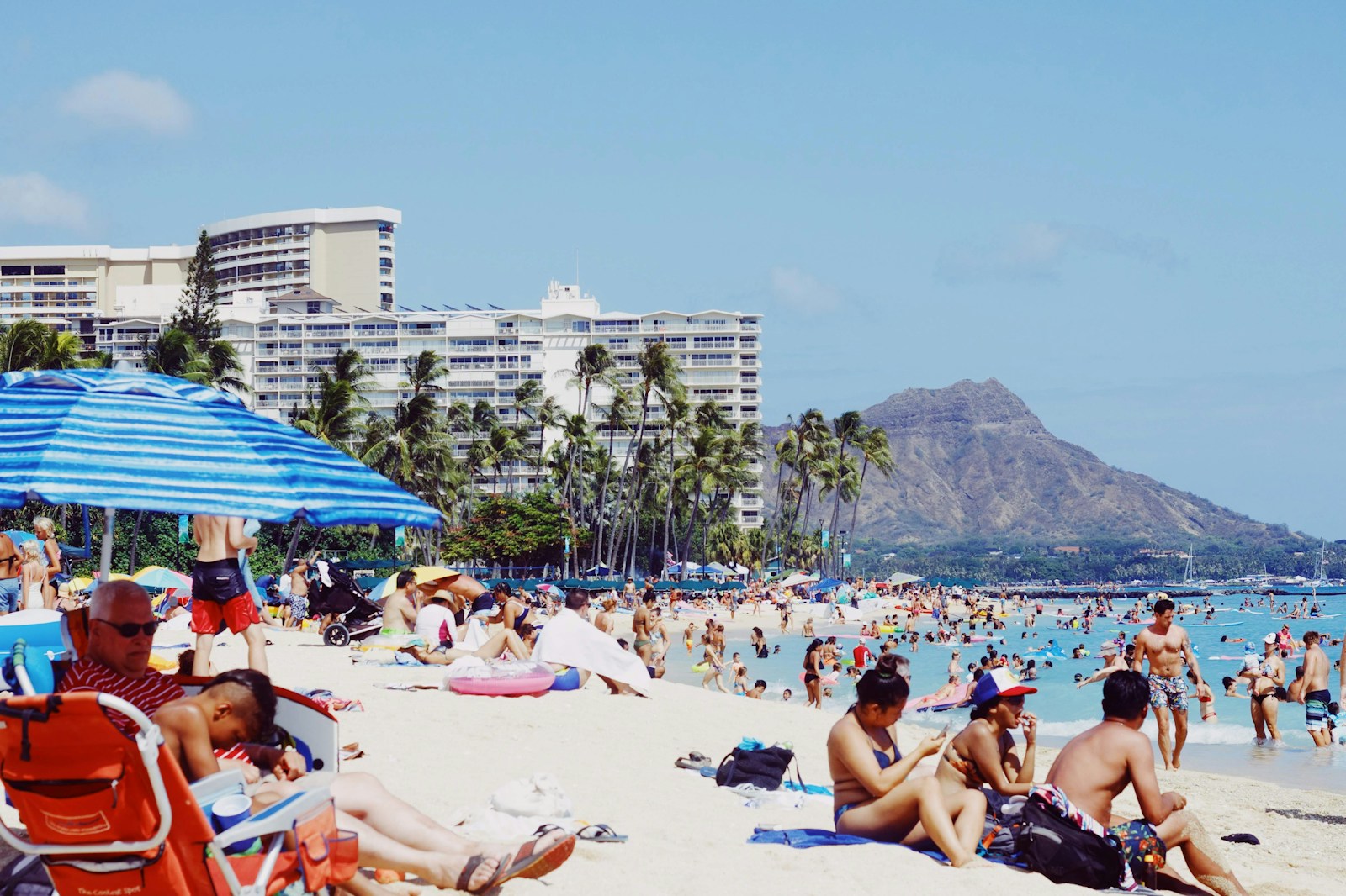 a large crowd of people at a beach